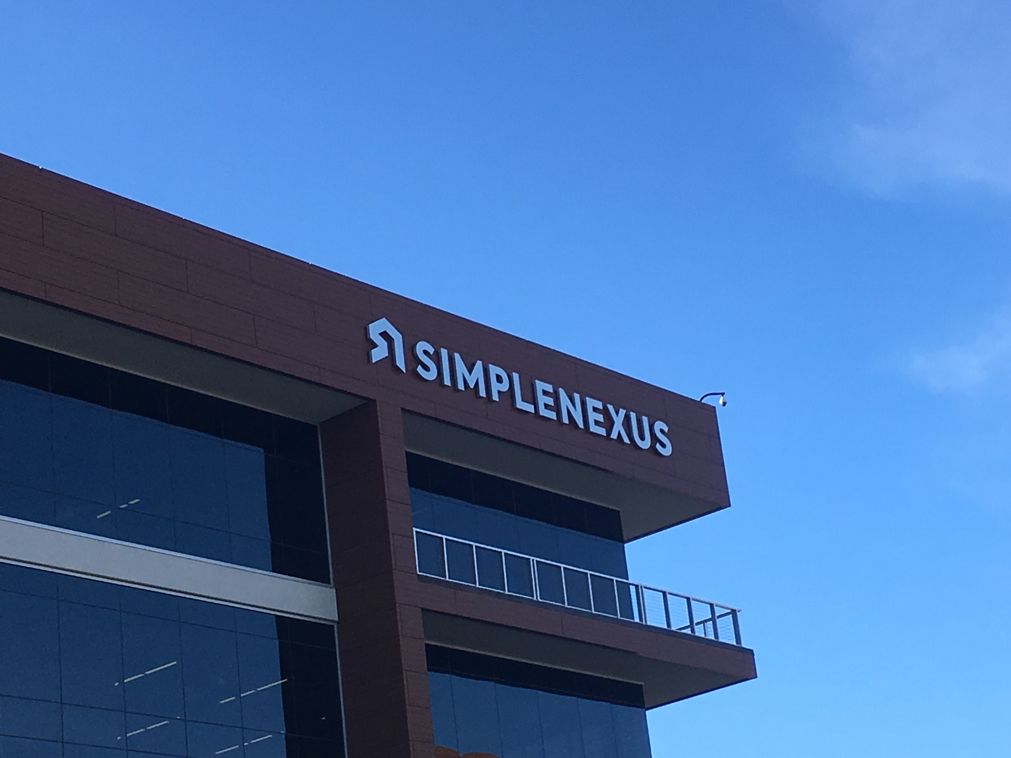 SimpleNexus office building with name on side.